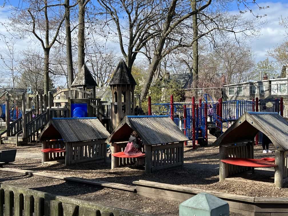 The playground at Kew Gardens, Toronto includes three climbers, swings and slides.