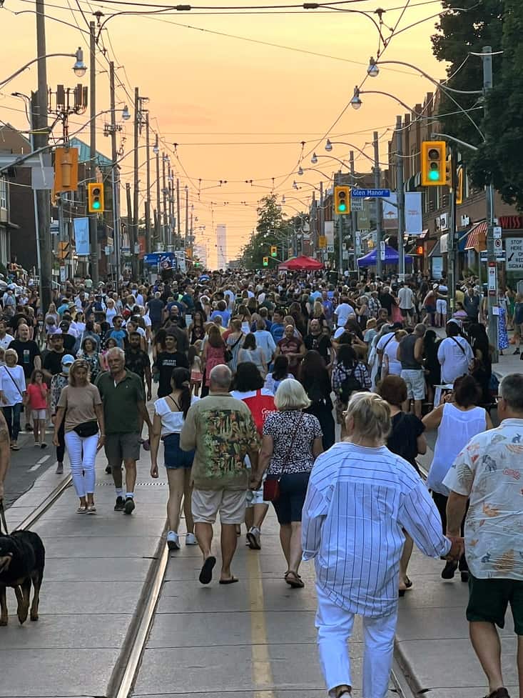 View of the crowds on Queen Street during the Beaches Jazz Festival StreetFest in the Beaches, Toronto.