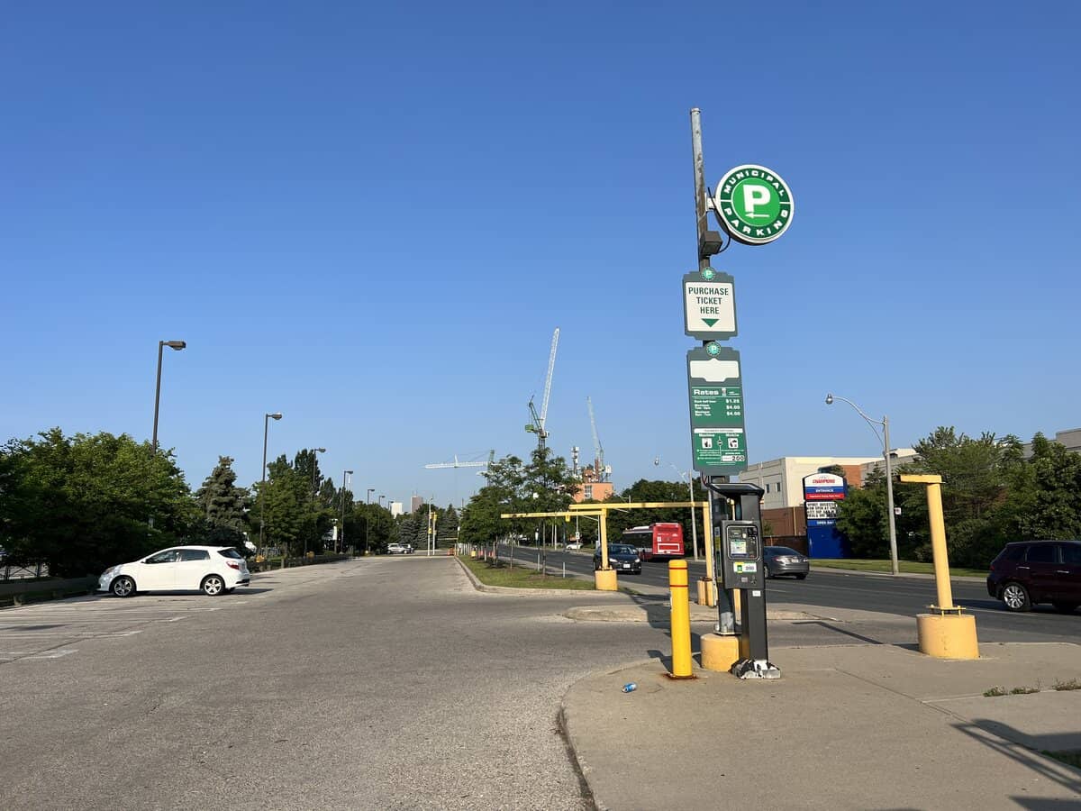 Green P sign for parking near HISTORY and Woodbine Beach.