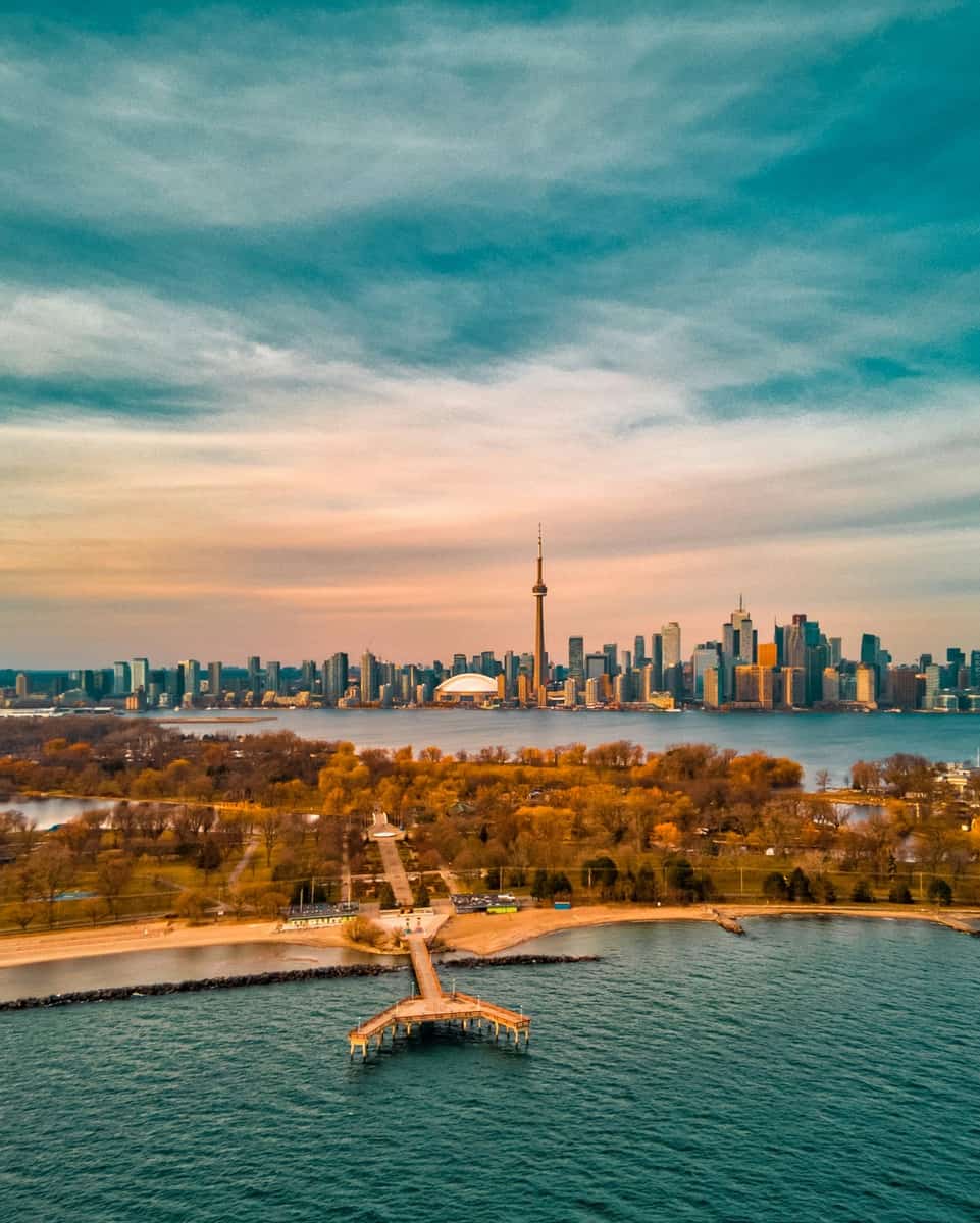 Drone photo of Centre Island with the Toronto Skyline including the CN Tower on a fall day.