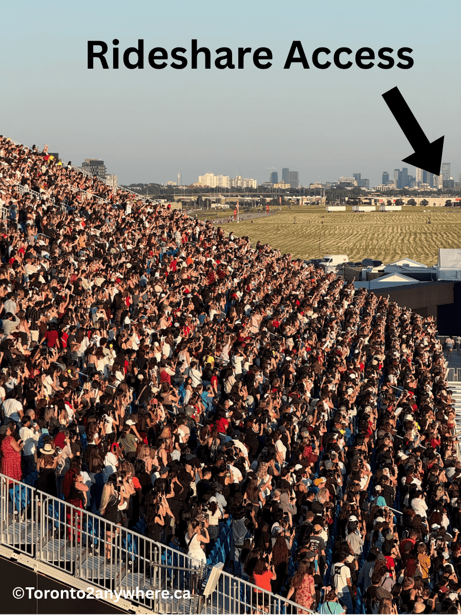 A packed grandstand full of cheering fans at Rogers Stadium in Toronto during a concert at sunset, with a large text overlay reading “Rideshare Access” and an arrow pointing toward a field area in the background. The city skyline is visible in the distance under a clear sky.