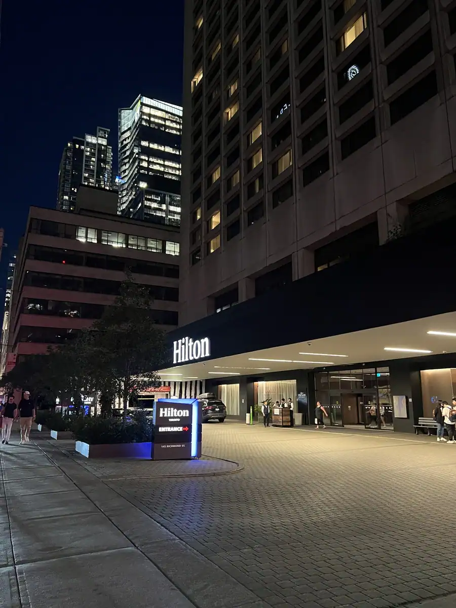 Entrance to the Hilton Toronto hotel located in downtown Toronto in the evening.