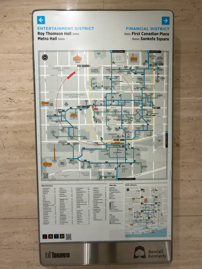 A posted map of the complicated PATH system in downtown Toronto. The map displays the various underground paths and attractions close to various landmarks in downtown Toronto.