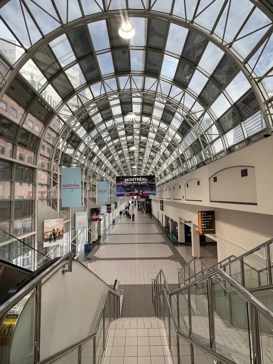 A glass covered pathway with stairs leading to Toronto's skywalk connecting Union Station and the Metro Convention Centre close to the CN Tower and Aquarium.
