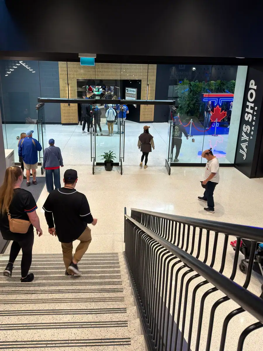 Blue Jays fans enter the exclusive Banner Club entrance at the Rogers Centre in Toronto. Fans walk down the stairs and have access to their own Jays Shop and private bar.