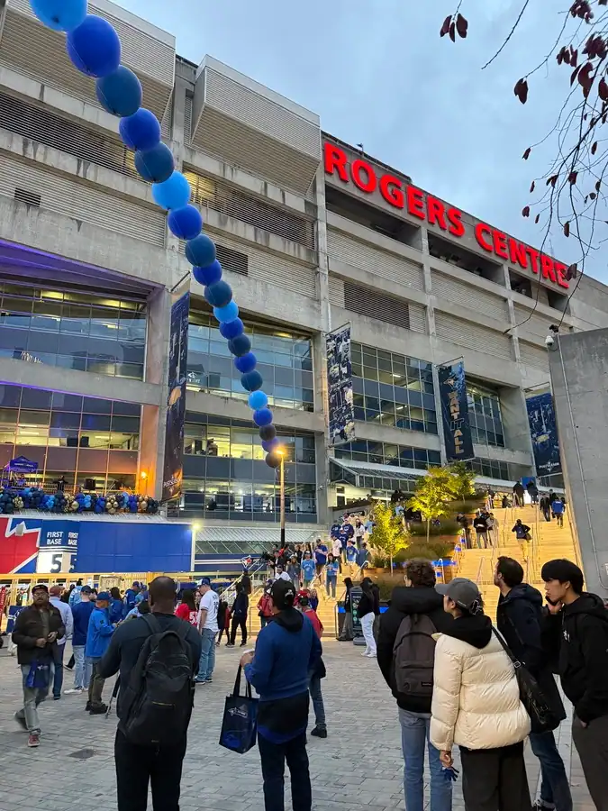 Fans enter the Rogers Centre in downtown Toronto ahead of a Blue Jays baseball game.