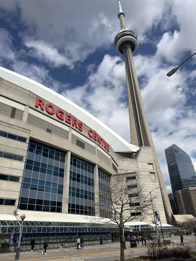 The exterior of Toronto's Rogers Centre and the CN Tower on a spring day in Toronto.
