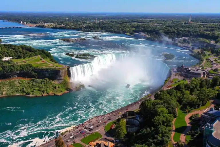 Aerial view of the Horseshoe Falls in Niagara Falls, Canada on a summer day. The Maid of the Mist can be seen at the base of Niagara Falls.