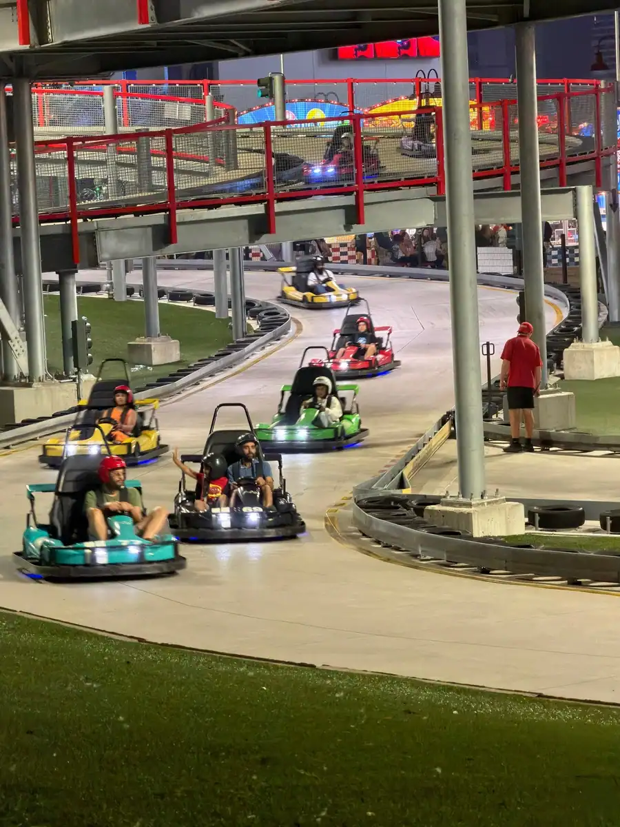 Riders in motorized GO Karts speed down the track at the Niagara Speedway on Clifton Hill in Niagara Falls, Canada.